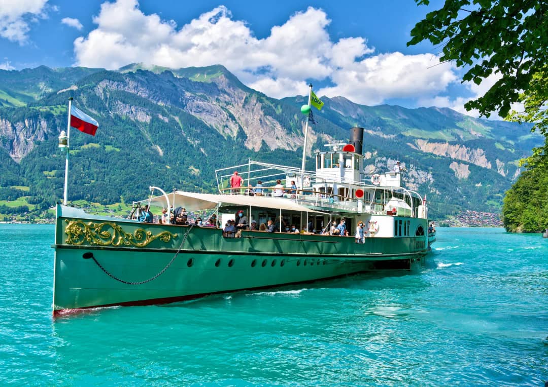BLS paddle steamer on turquoise Lake Brienz with Swiss Alps in the background, day trip from Interlaken Switzerland