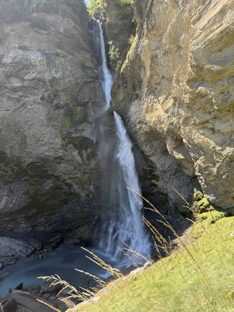 Reichenbach Falls dropping into its rocky gorge above Meiringen, seen from the viewpoint in August sunshine
