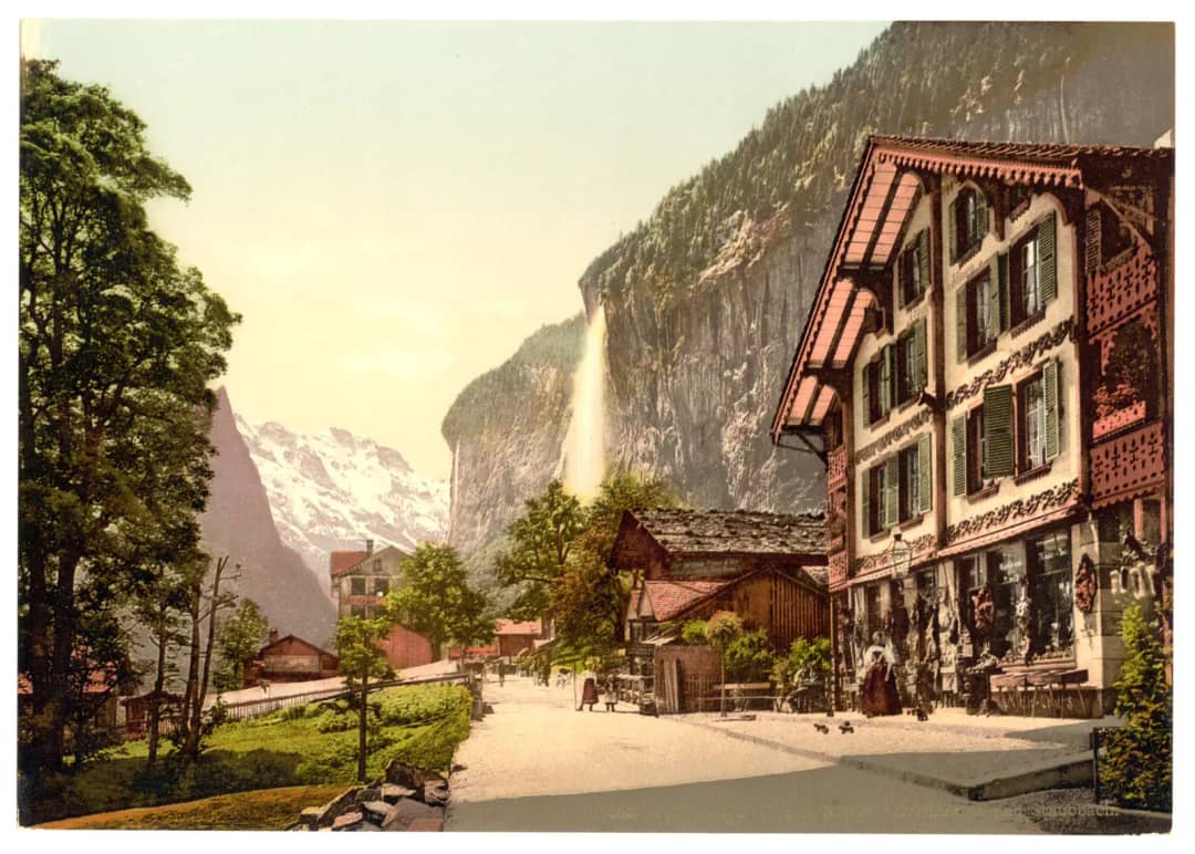 Photochrom print of the Lauterbrunnen village street below the Staubbach falls in the 1890s tourist era