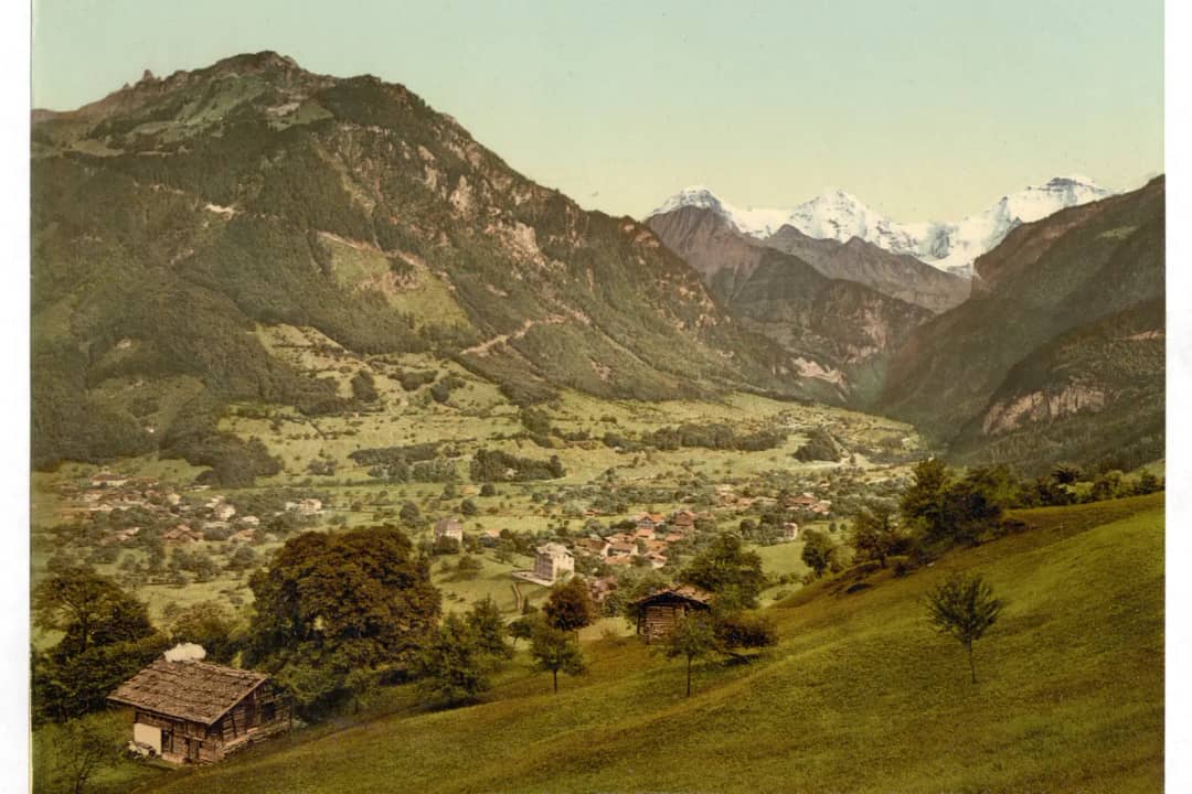 Wilderswil village below the Schynige Platte, with the Eiger, Mönch and Jungfrau on the skyline behind it