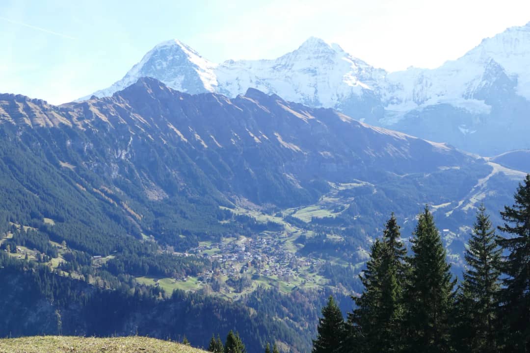 Wengen on its terrace above the Lauterbrunnen valley, seen from Isenfluh, with the Eiger, Mönch and Jungfrau