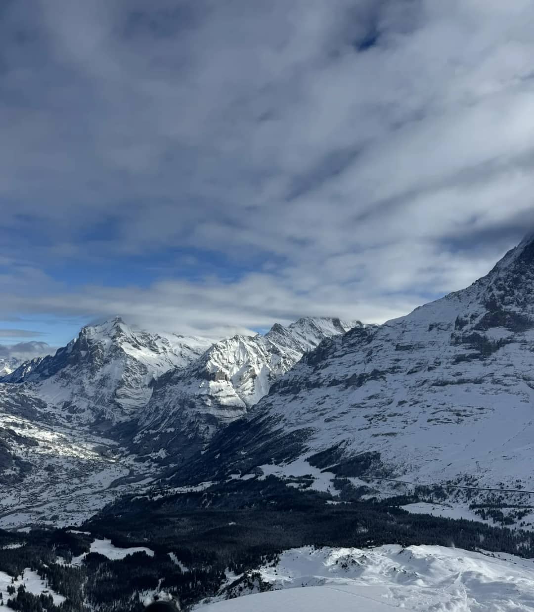 View over the snowy Lauterbrunnen valley and high peaks in December, the setting of sledding in Switzerland