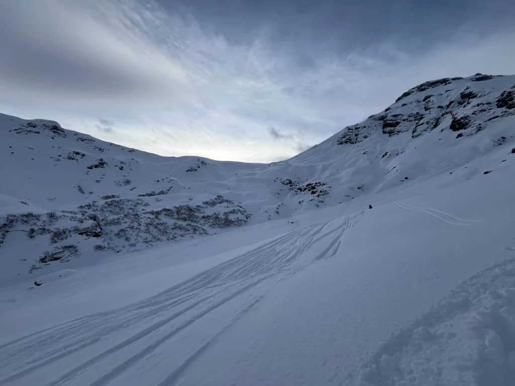 Snow bowl in the Schilthorn ski area in January, wide and empty, the quiet terrain Pierre skis above MĂĽrren