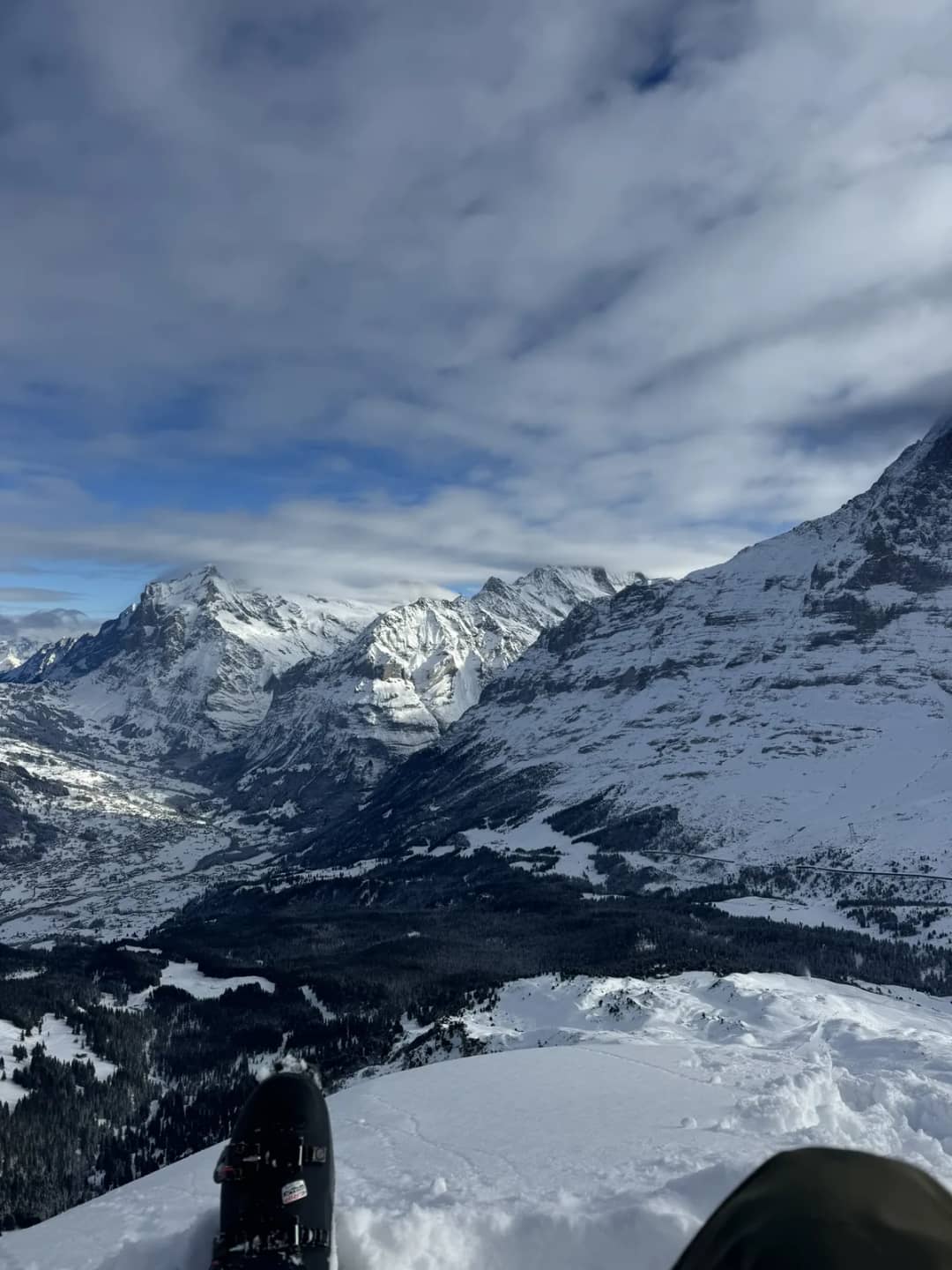 View from the Mürren ski area over snowy peaks and the deep Lauterbrunnen valley on a clear December day